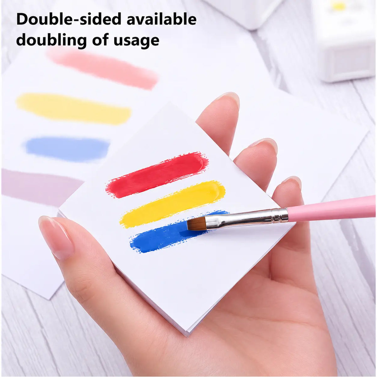 Gel polish color swatches on double-sided nail art palette paper